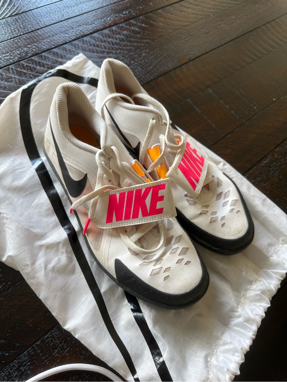 Women’s 7.5 track n field  Sneakers with Black Swoosh and Pink Logo stra